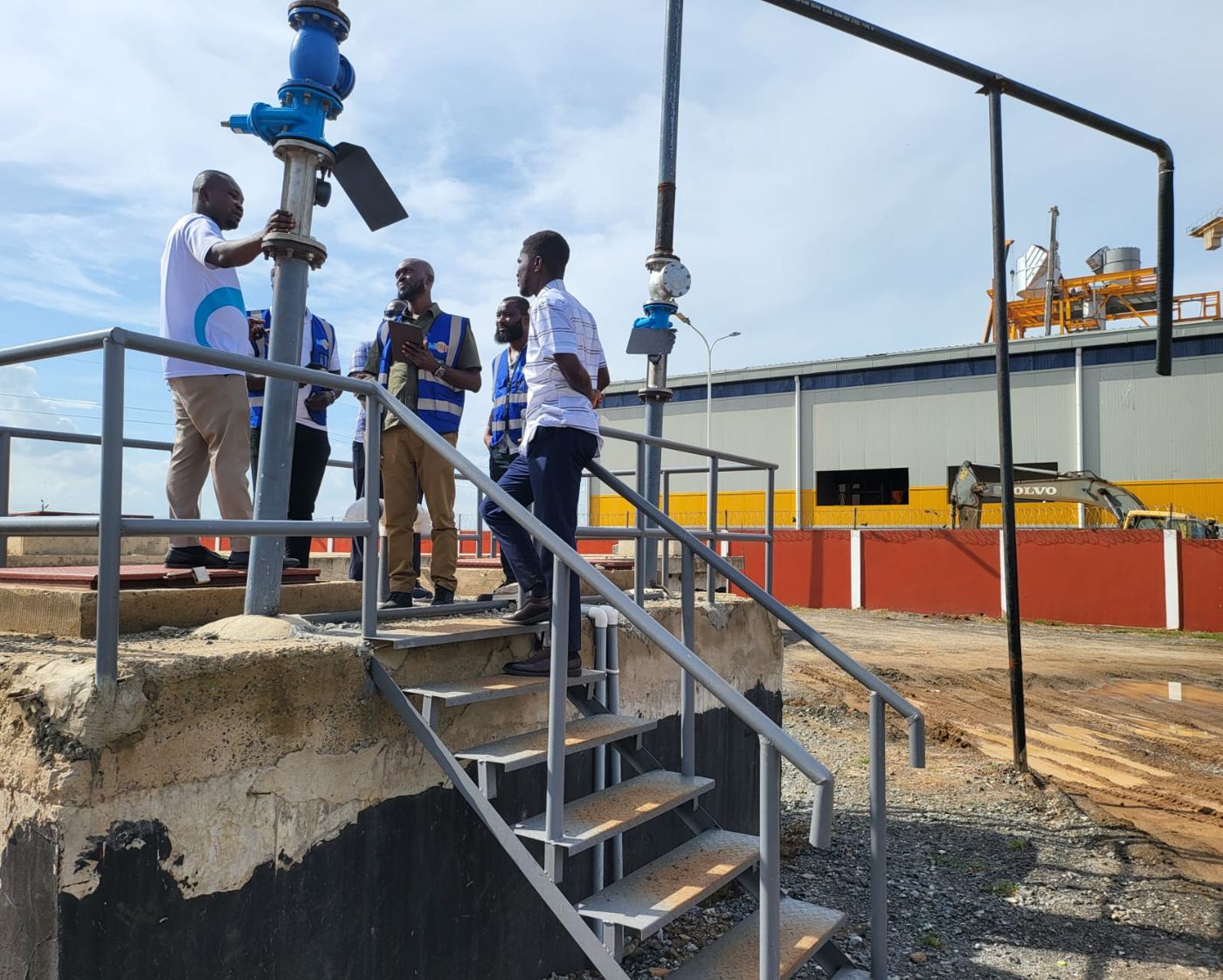 Engineers inspecting a field installation